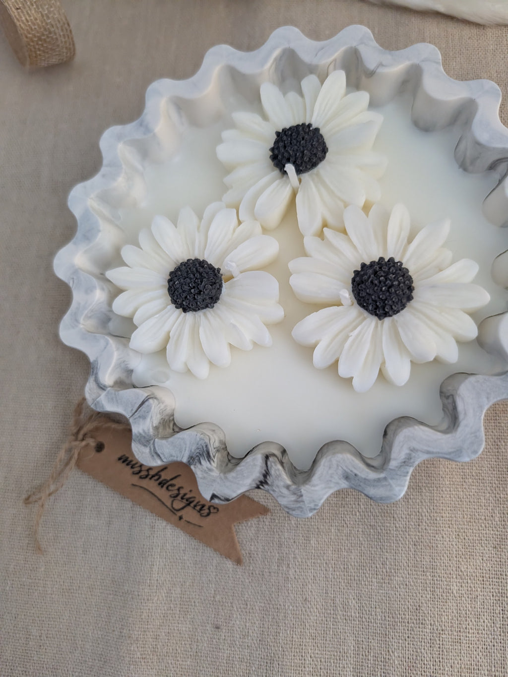 Daisy scented candle made from jesmonite eco resin filled with scented soy wax hand cast stone pot natural black marble three daisies