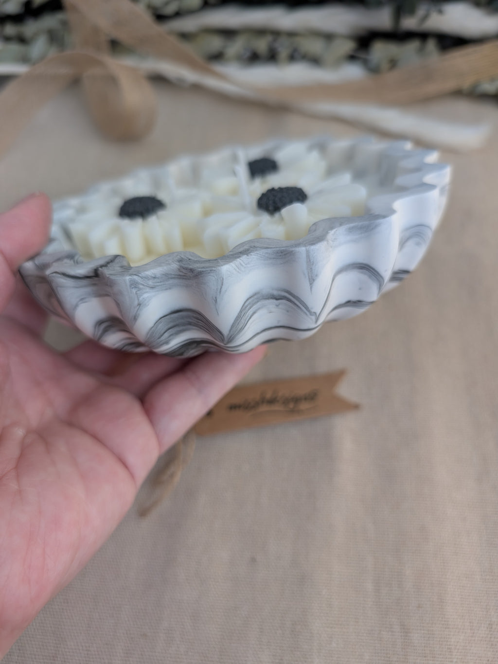 Daisy scented candle made from jesmonite eco resin filled with scented soy wax hand cast stone pot natural black marble three daisies
