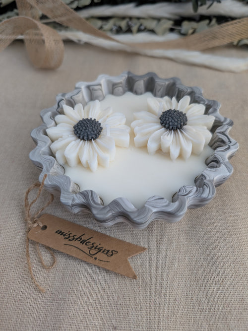 Daisy scented candle made from jesmonite eco resin filled with scented soy wax hand cast stone pot black marble two daisies