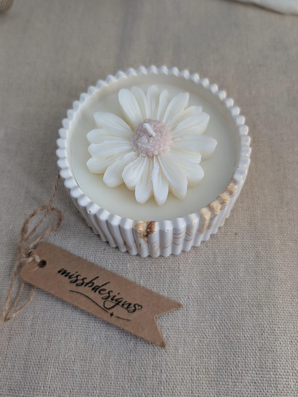 Daisy scented candle made from jesmonite eco resin filled with scented soy wax hand cast stone pot natural marble