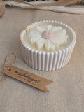 Daisy scented candle made from jesmonite eco resin filled with scented soy wax hand cast stone pot natural marble