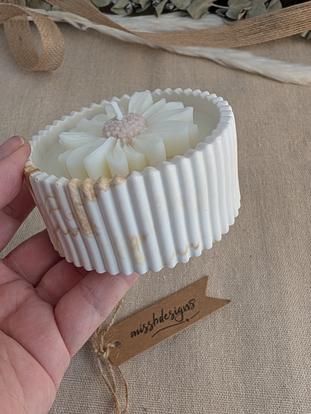 Daisy scented candle made from jesmonite eco resin filled with scented soy wax hand cast stone pot natural marble