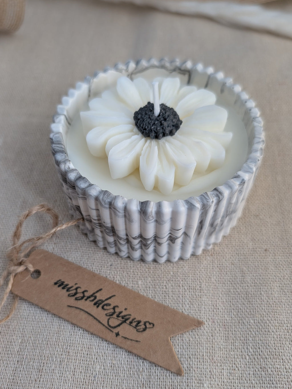 Daisy scented candle made from jesmonite eco resin filled with scented soy wax hand cast stone pot black marble