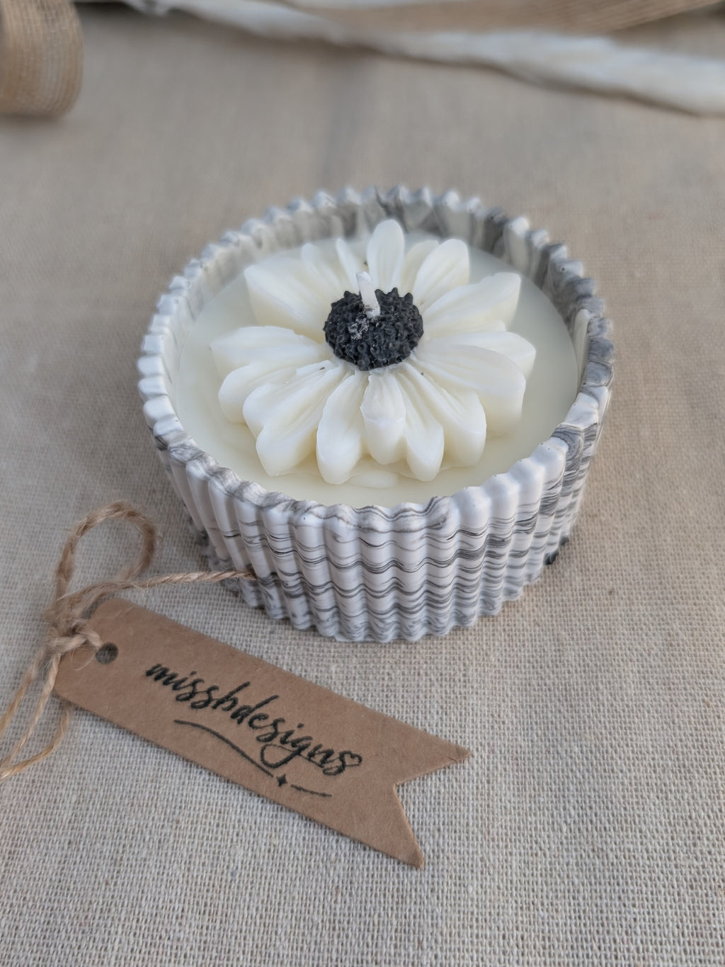 Daisy scented candle made from jesmonite eco resin filled with scented soy wax hand cast stone pot natural marble