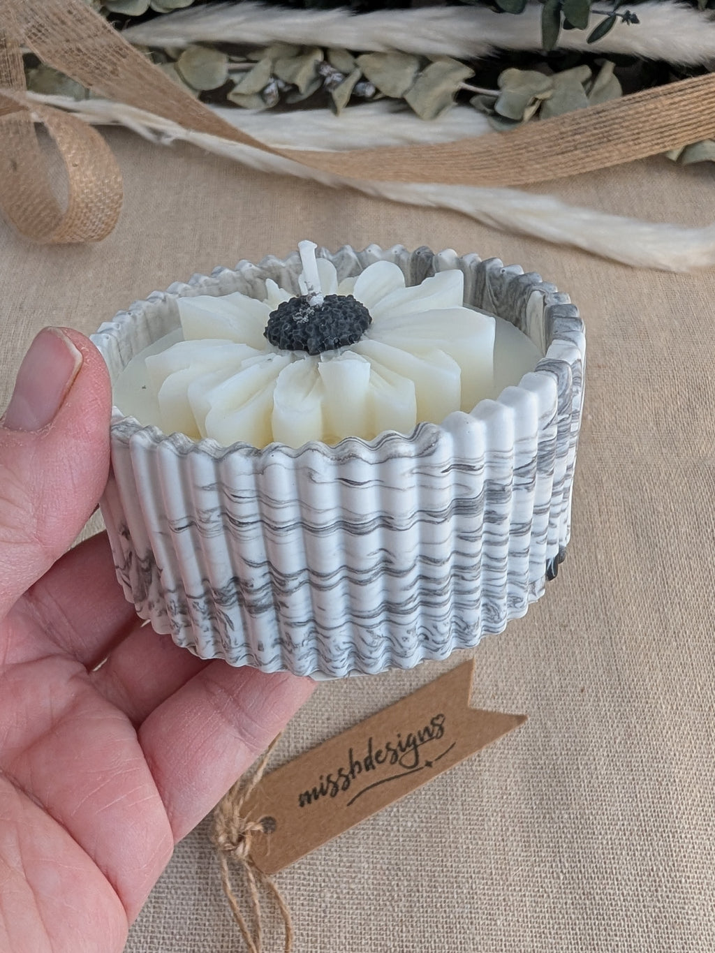 Daisy scented candle made from jesmonite eco resin filled with scented soy wax hand cast stone pot natural marble