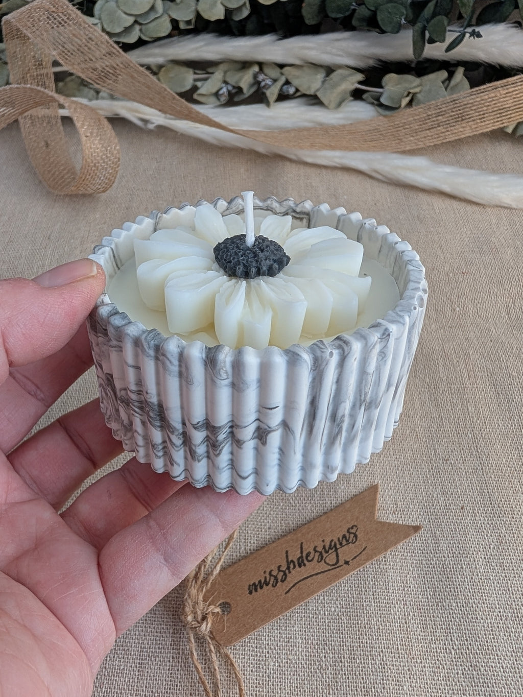 Daisy scented candle made from jesmonite eco resin filled with scented soy wax hand cast stone pot natural marble