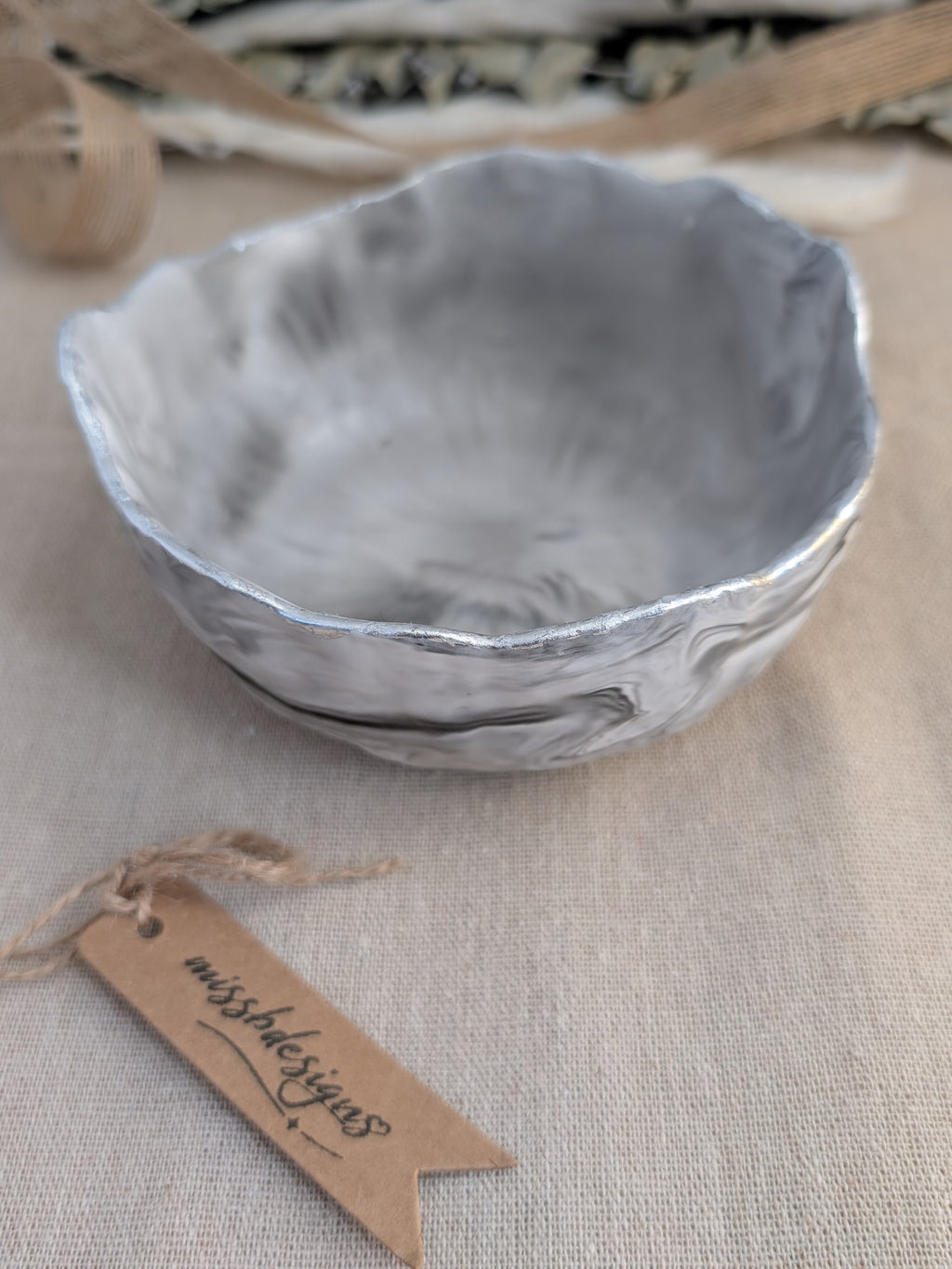 Trinket bowl black marbled hand crafted jesmonite with silver foil trimmed edge 