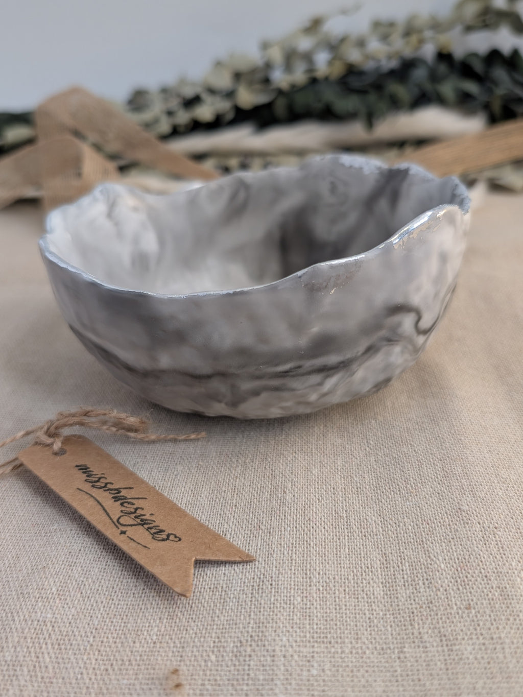 Trinket bowl black marbled hand crafted jesmonite with silver foil trimmed edge handcrafted