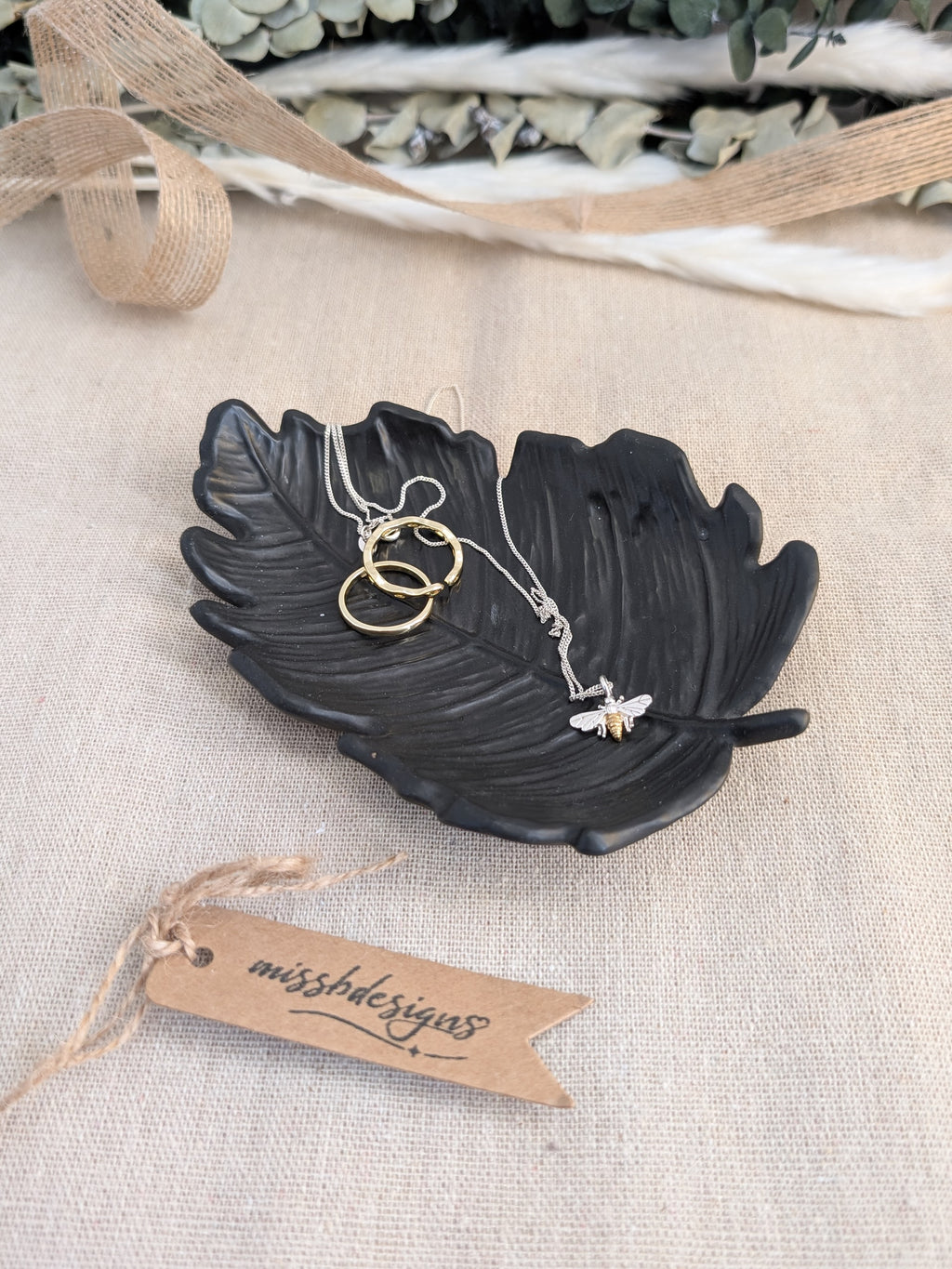 leaf shaped trinket tray made of eco resin jesmonite with a solid black finish handcrafted