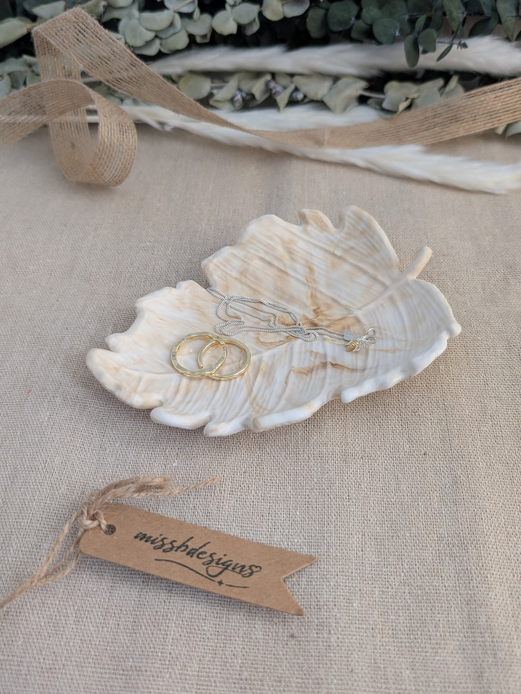 leaf shaped trinket tray made of eco resin jesmonite with a natural beige marble effect handcrafted