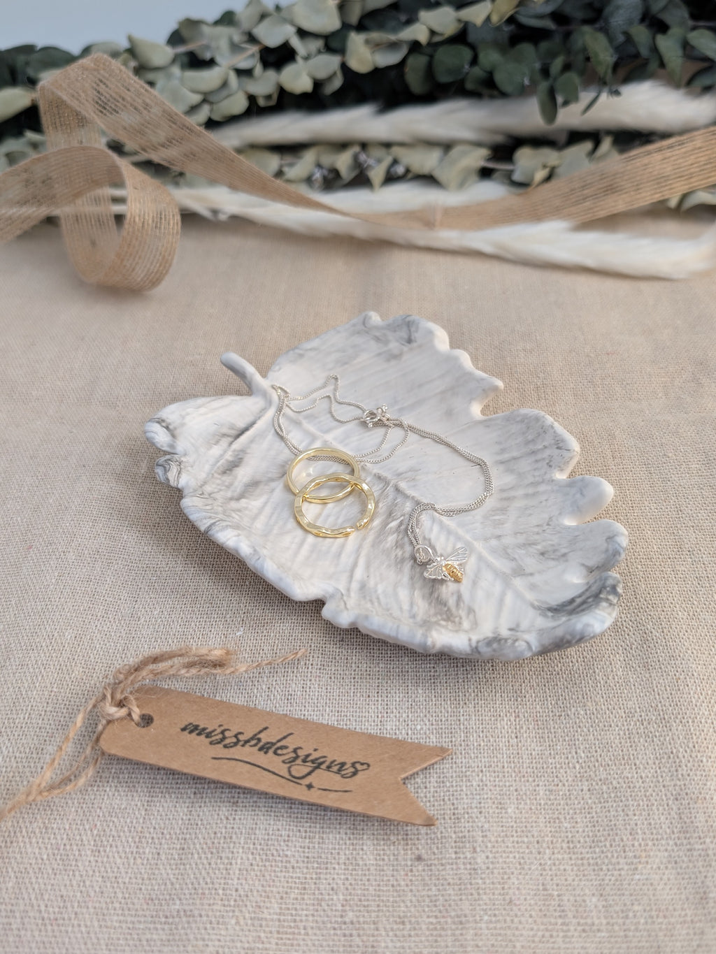 leaf shaped trinket tray made of eco resin jesmonite with a black marble effect handcrafted