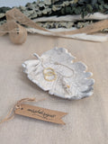 leaf shaped trinket tray made of eco resin jesmonite with a black marble effect handcrafted