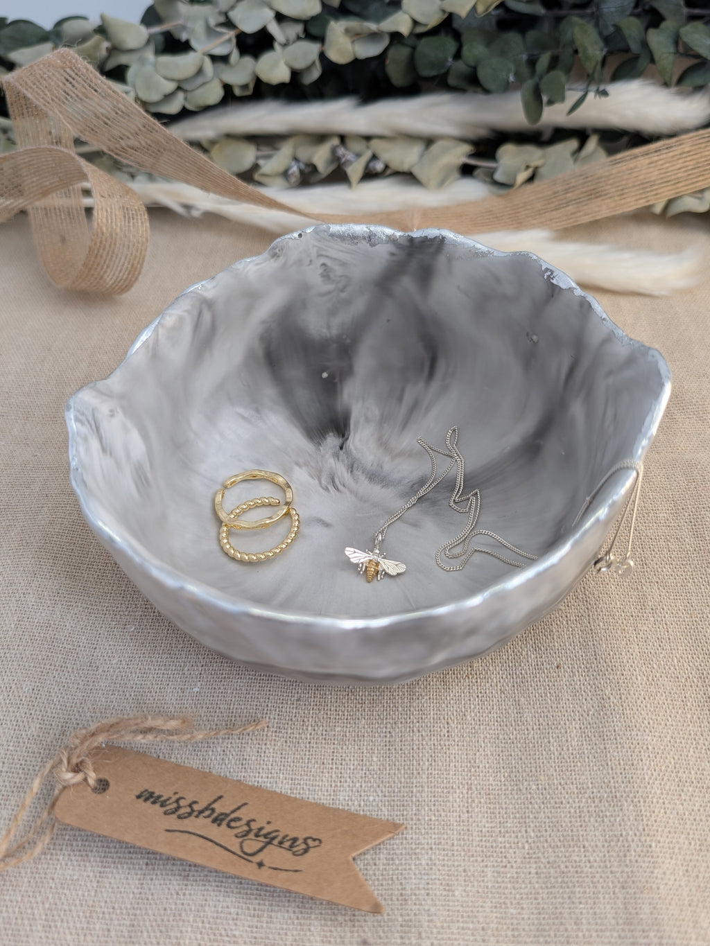 Trinket bowl black marbled hand crafted jesmonite with silver foil trimmed edge 