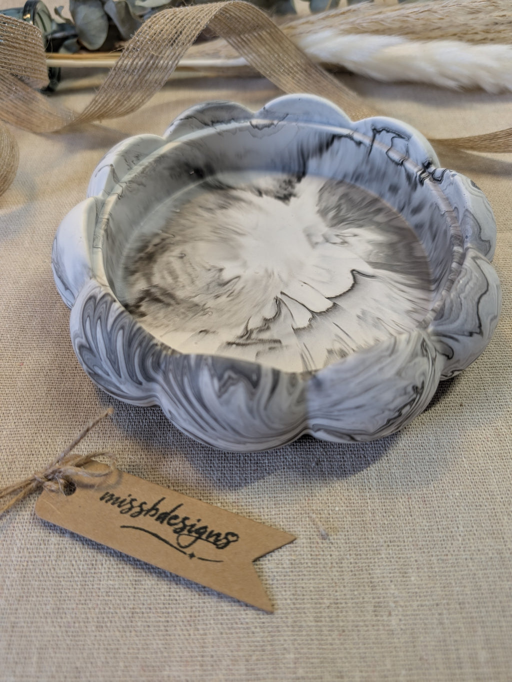 Flower Trinket bowl for home decor made of eco resin jesmonite with a black marbled effect 