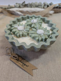 Natural sage green triple daisy candles in neutral green hand cast eco resin home decor pot scented with vanilla perfect gift