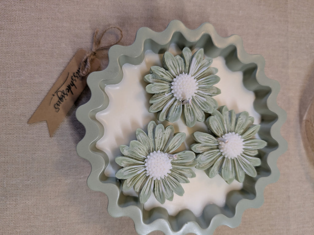 Natural sage green triple daisy candles in neutral green hand cast eco resin home decor pot scented with vanilla perfect gift