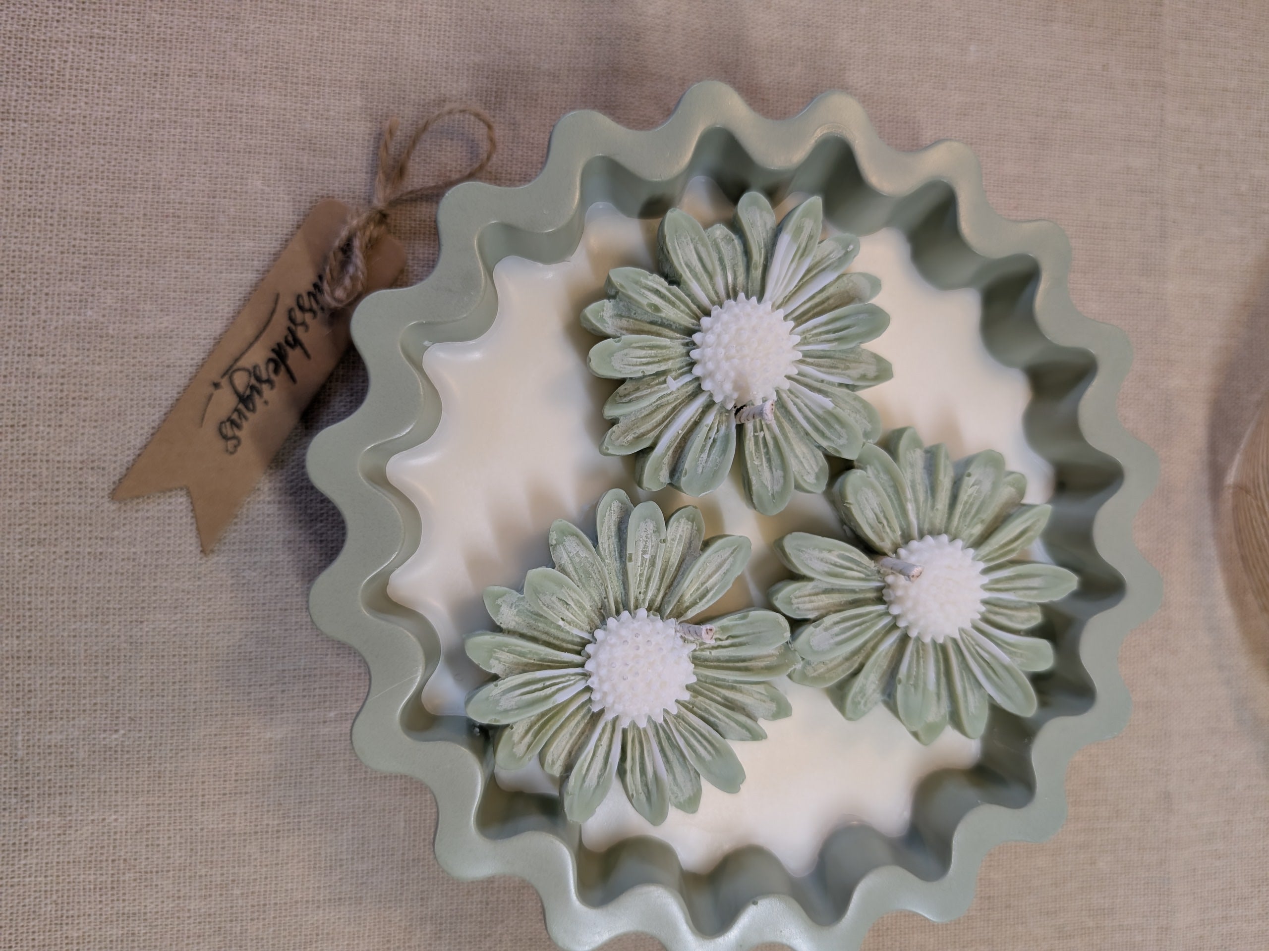 Natural sage green triple daisy candles in neutral green hand cast eco resin home decor pot scented with vanilla perfect gift