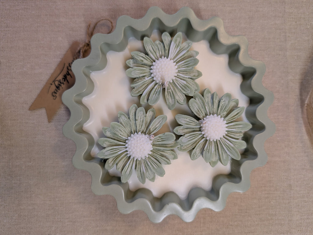 Natural sage green triple daisy candles in neutral green hand cast eco resin home decor pot scented with vanilla perfect gift