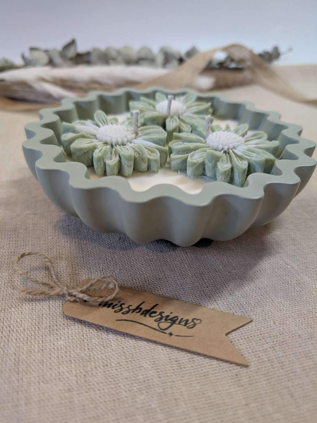 Natural sage green triple daisy candles in neutral green hand cast eco resin home decor pot scented with vanilla perfect gift