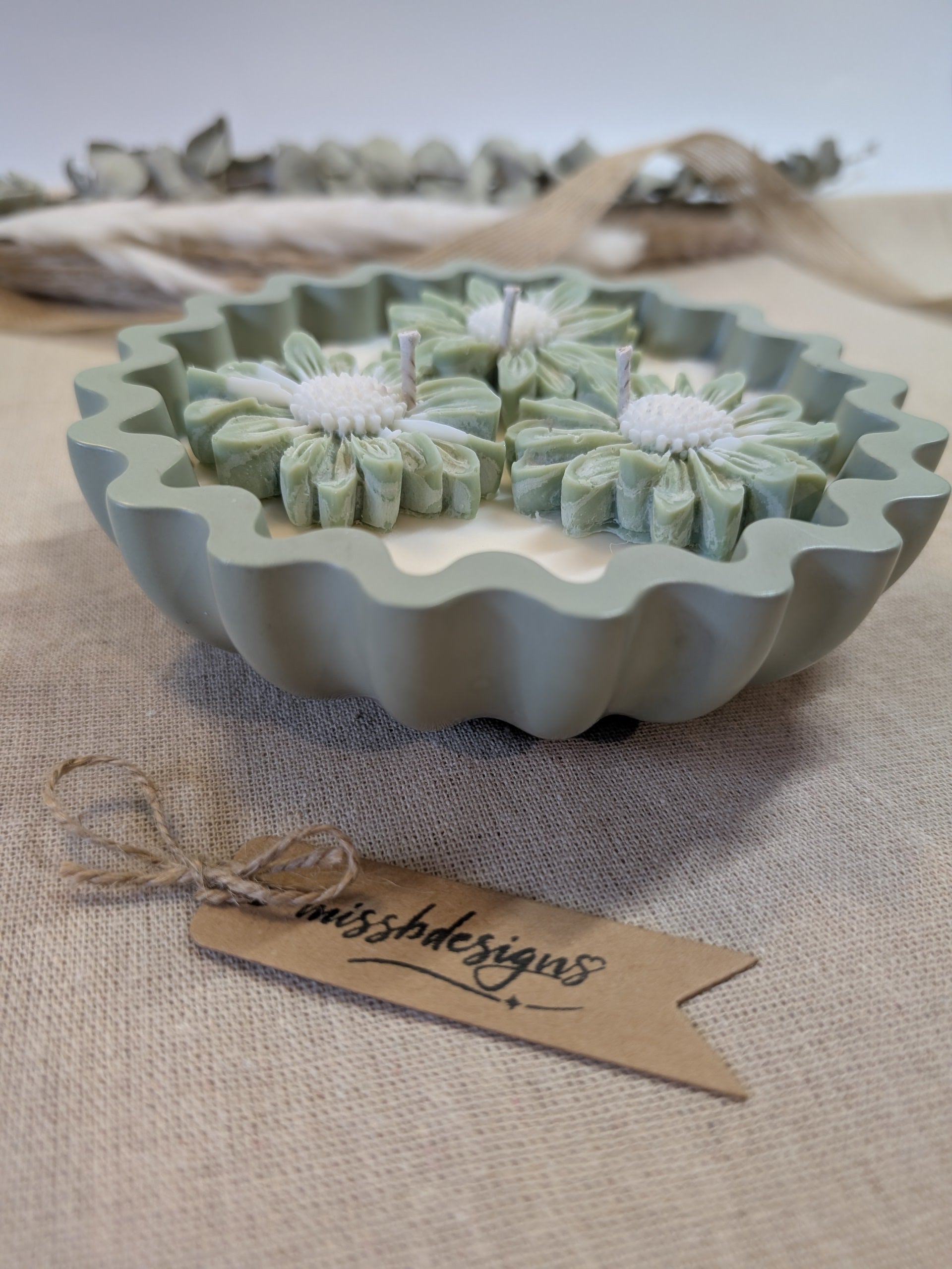 Natural sage green triple daisy candles in neutral green hand cast eco resin home decor pot scented with vanilla perfect gift