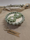 Natural sage green daisy candles in neutral green hand cast eco resin home decor pot scented with vanilla perfect gift