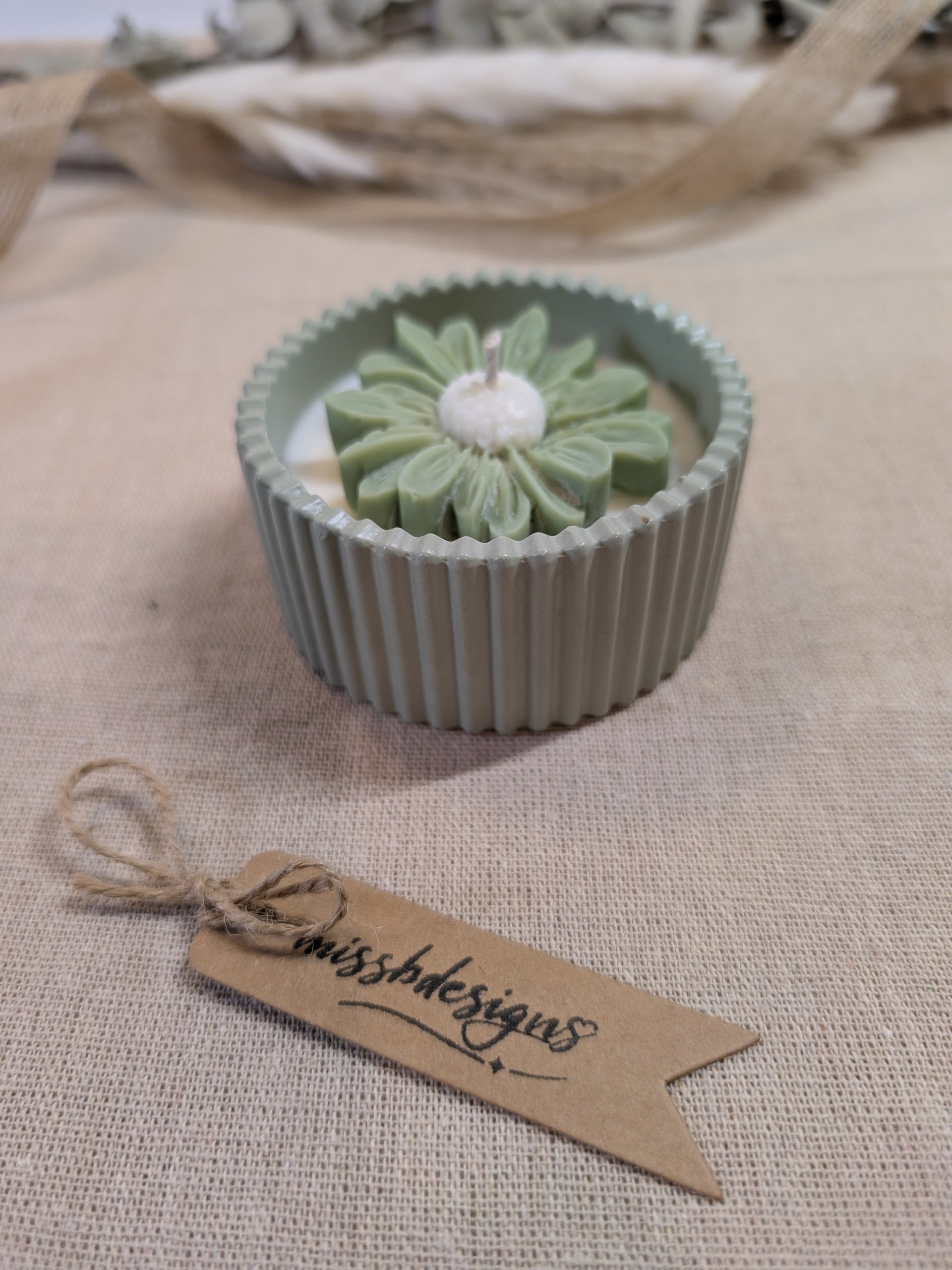 Natural sage green daisy candle in neutral green hand cast eco resin home decor pot scented with vanilla perfect gift