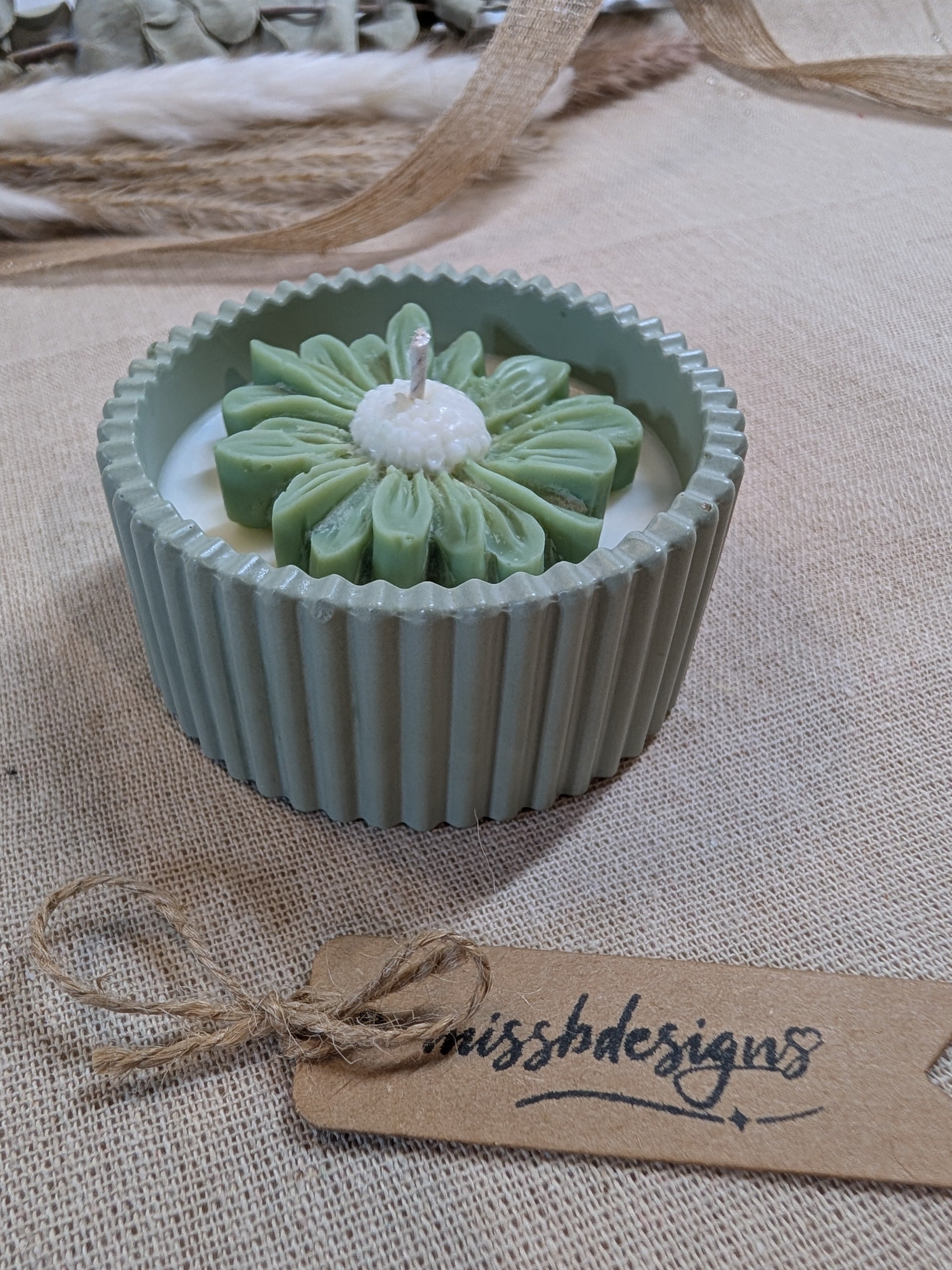 Natural sage green daisy candle in neutral green hand cast eco resin home decor pot scented with vanilla perfect gift