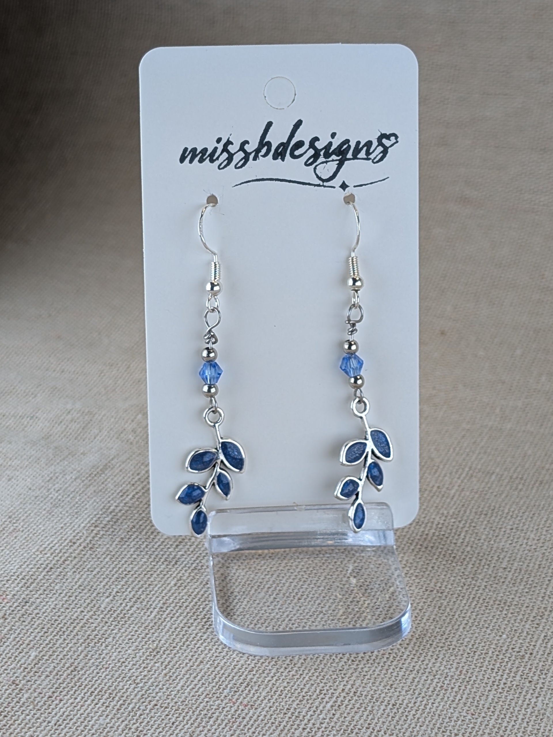Silver plated sapphire blue resin hand crafted leaf drop earrings