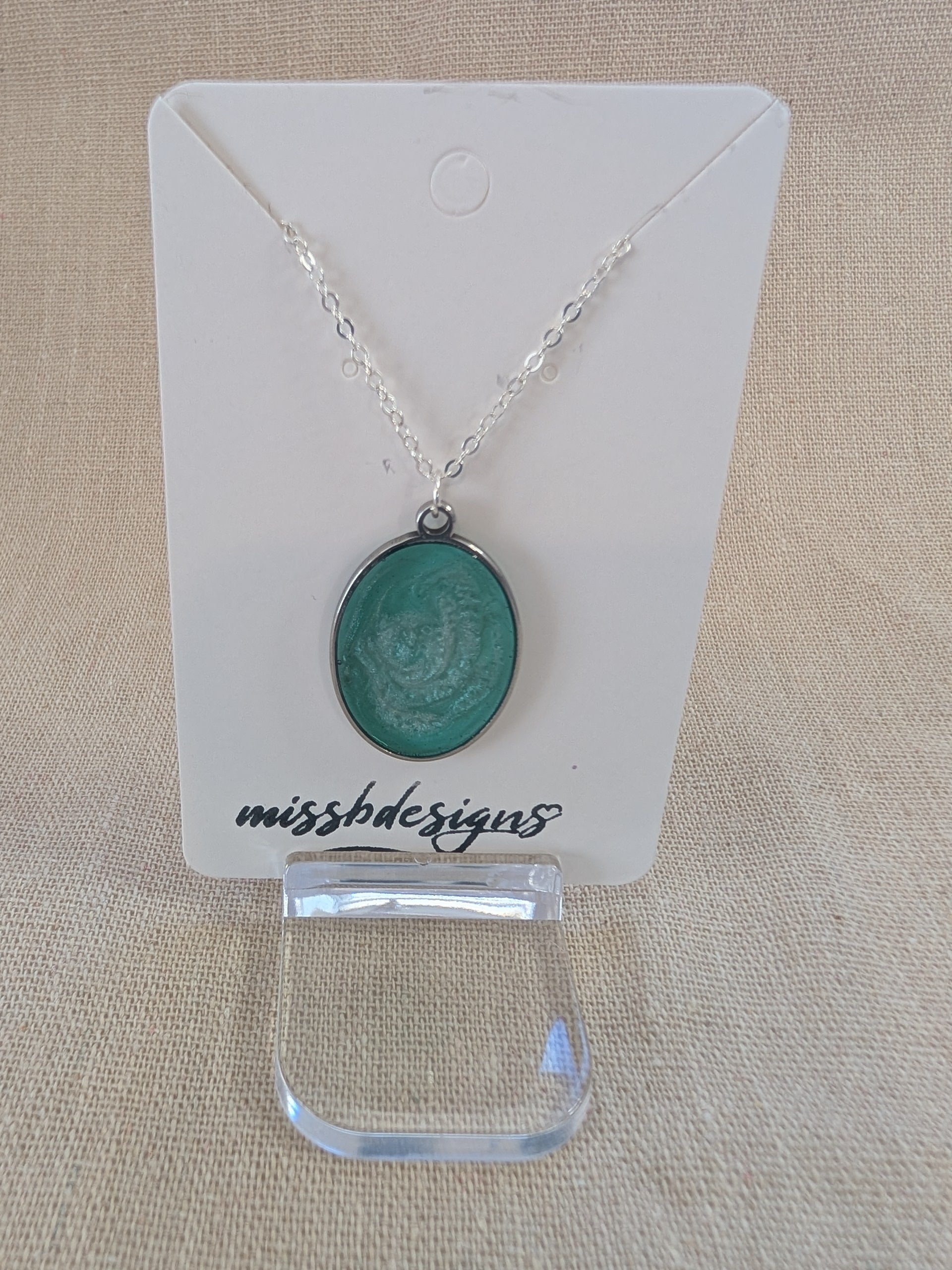 Necklace with a green resin  pendant on silver chain handcrafted