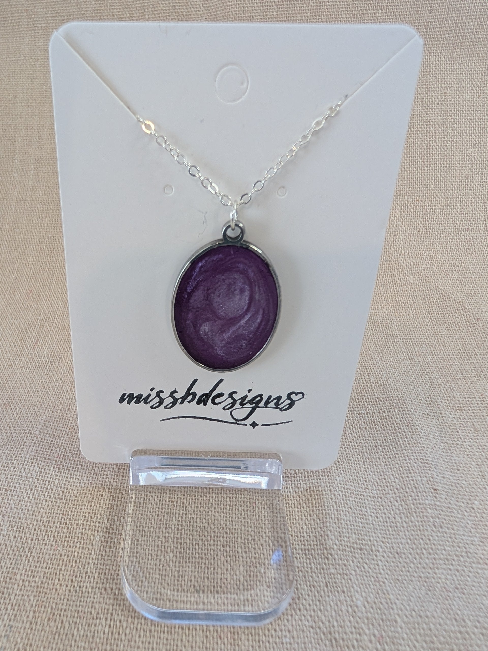 Necklace with a purple resin  pendant on silver chain handcrafted